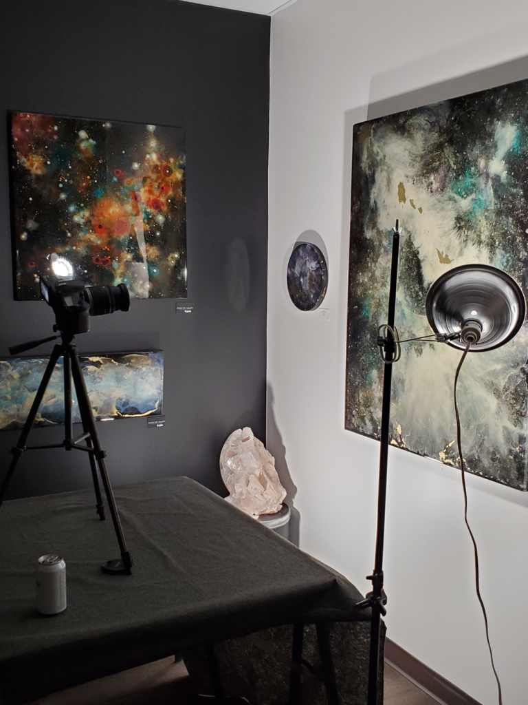 Aaron K Metz working in his crystal art studio surrounded by tools and materials