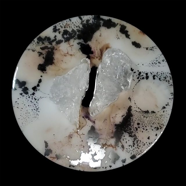 Elegant selenite crystal artwork 'Elemental 139' with twin selenite formations and flowing bluish pink metallic mica and liquid chrome on white circular panel by artist Aaron K Metz