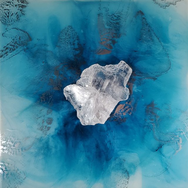 Spectacular ocean-inspired artwork 'Elemental 146' featuring luminous selenite crystal with radiating Caribbean blue and turquoise waves and light-responsive liquid chrome by artist Aaron K Metz