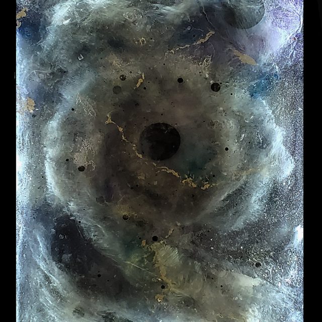 Striking illuminated artwork 'Ethos' featuring 15+ kg of crystals including Selenite, Lepidolite, Peridot, Libyan Gold Tektite, and Quartz suspended in eco soy resin with LED lighting in a custom hardwood frame by artist Aaron K Metz
