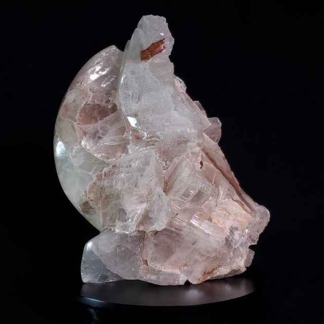Monumental Fertility 5 selenite crystal sculpture with dramatic contrasts between smooth carved surfaces and raw crystalline formations with substantial iron-rich earth inclusions hand-carved by Aaron K Metz