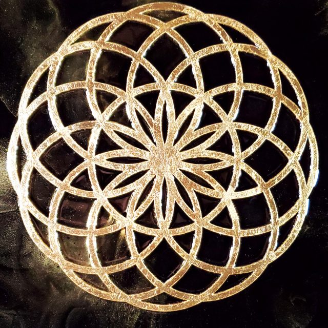 Striking square artwork 'Lotus of Life' featuring a radiant copper/gold leafed sacred geometry pattern emerging from deep black shungite-infused epoxy with gold mica streams by artist Aaron K Metz