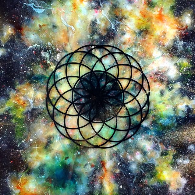 Vibrant cosmic artwork 'Solar Return' featuring black lotus sacred geometry suspended in radiant yellow, orange, and turquoise nebula with crystal infusions by artist Aaron K Metz