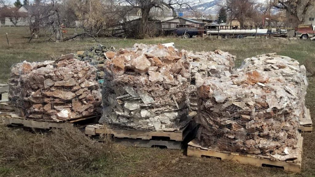 One-ton bundles of raw selenite crystal on palettes after extraction in Utah